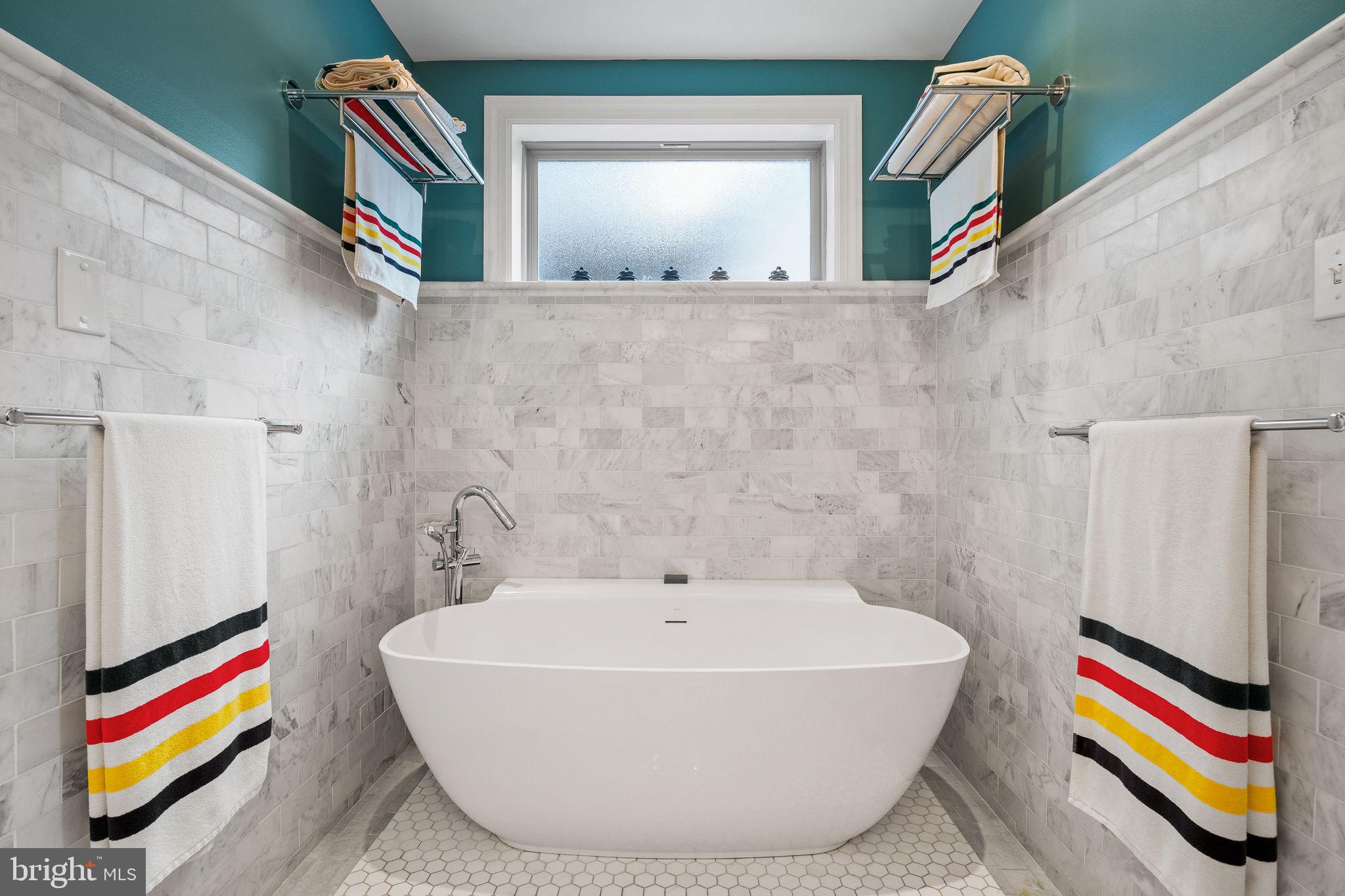 308 Monastery Avenue Philadelphia, PA 19128 - Photo 48 of 70 a bathroom with a tub and a window