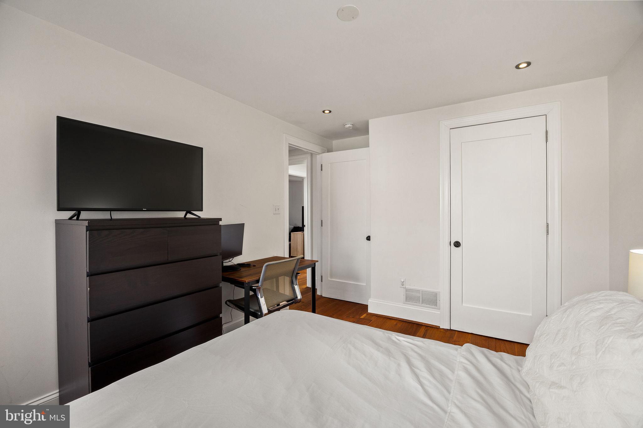 308 Monastery Avenue Philadelphia, PA 19128 - Photo 54 of 70 a bedroom with a bed and a flat screen tv