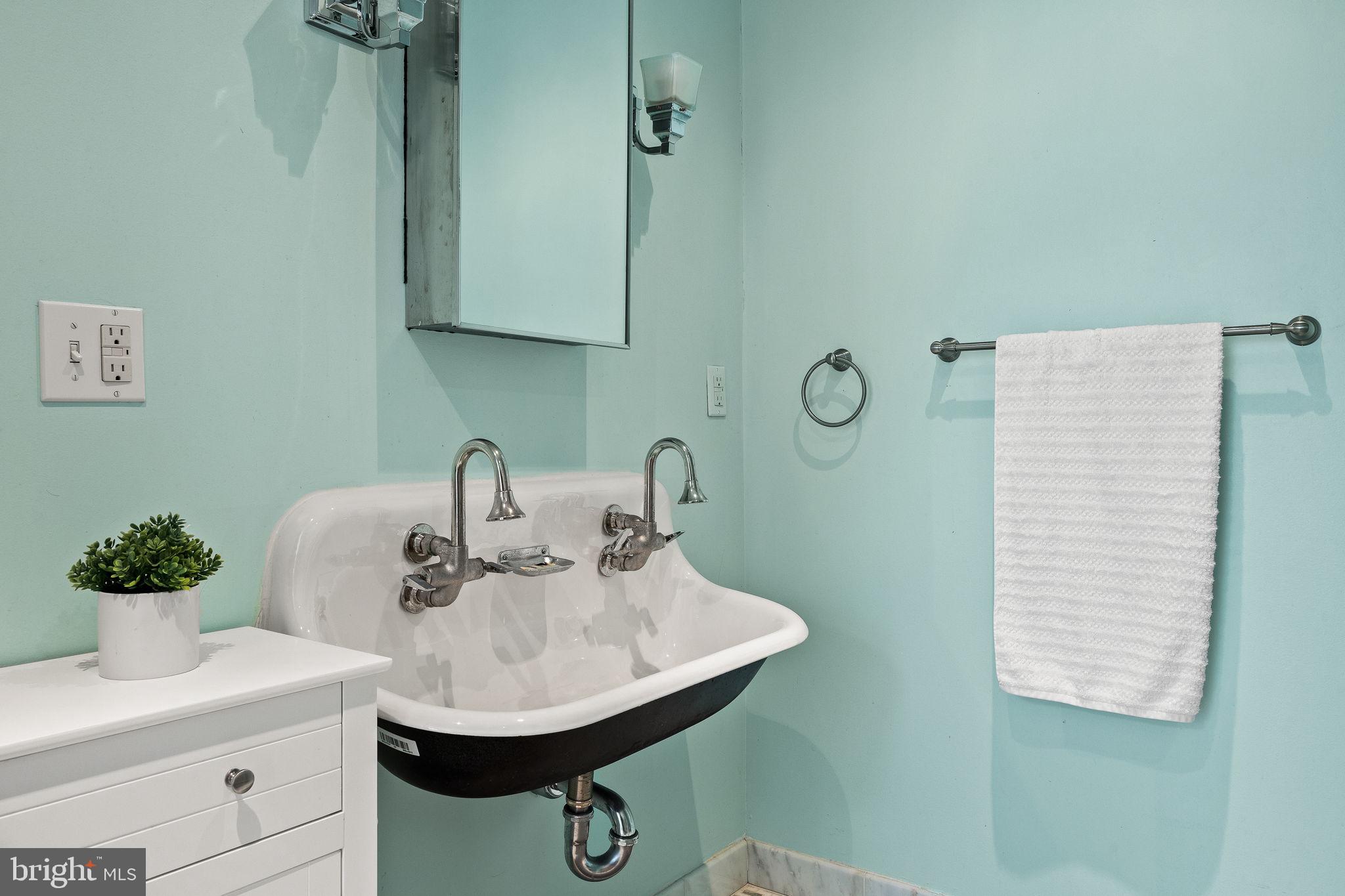 308 Monastery Avenue Philadelphia, PA 19128 - Photo 56 of 70 a bathroom with a sink and a mirror