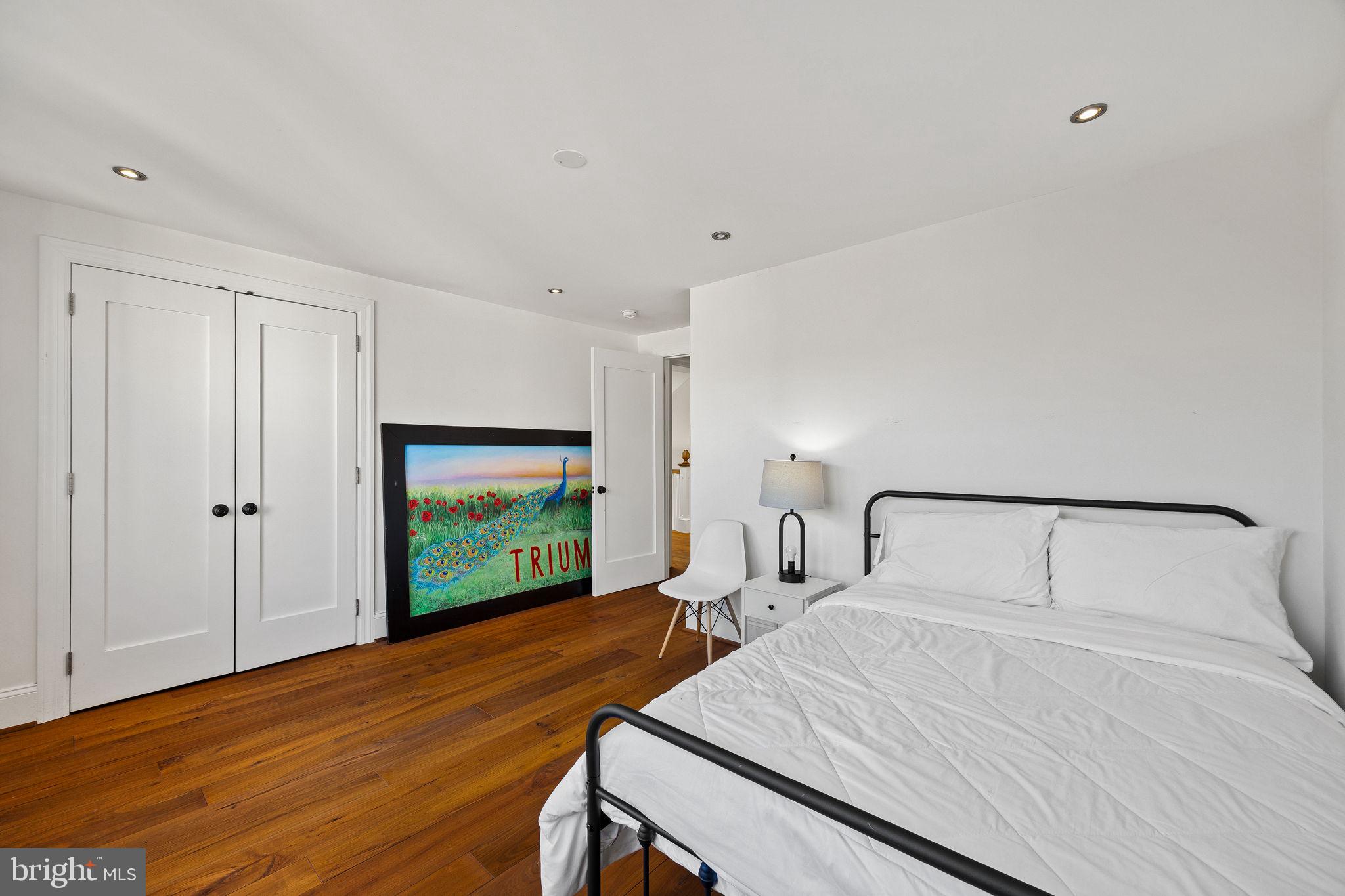 308 Monastery Avenue Philadelphia, PA 19128 - Photo 59 of 70 a bedroom with a bed and a flat screen tv