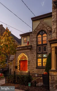 a view of entryway with wooden floor and stairs
