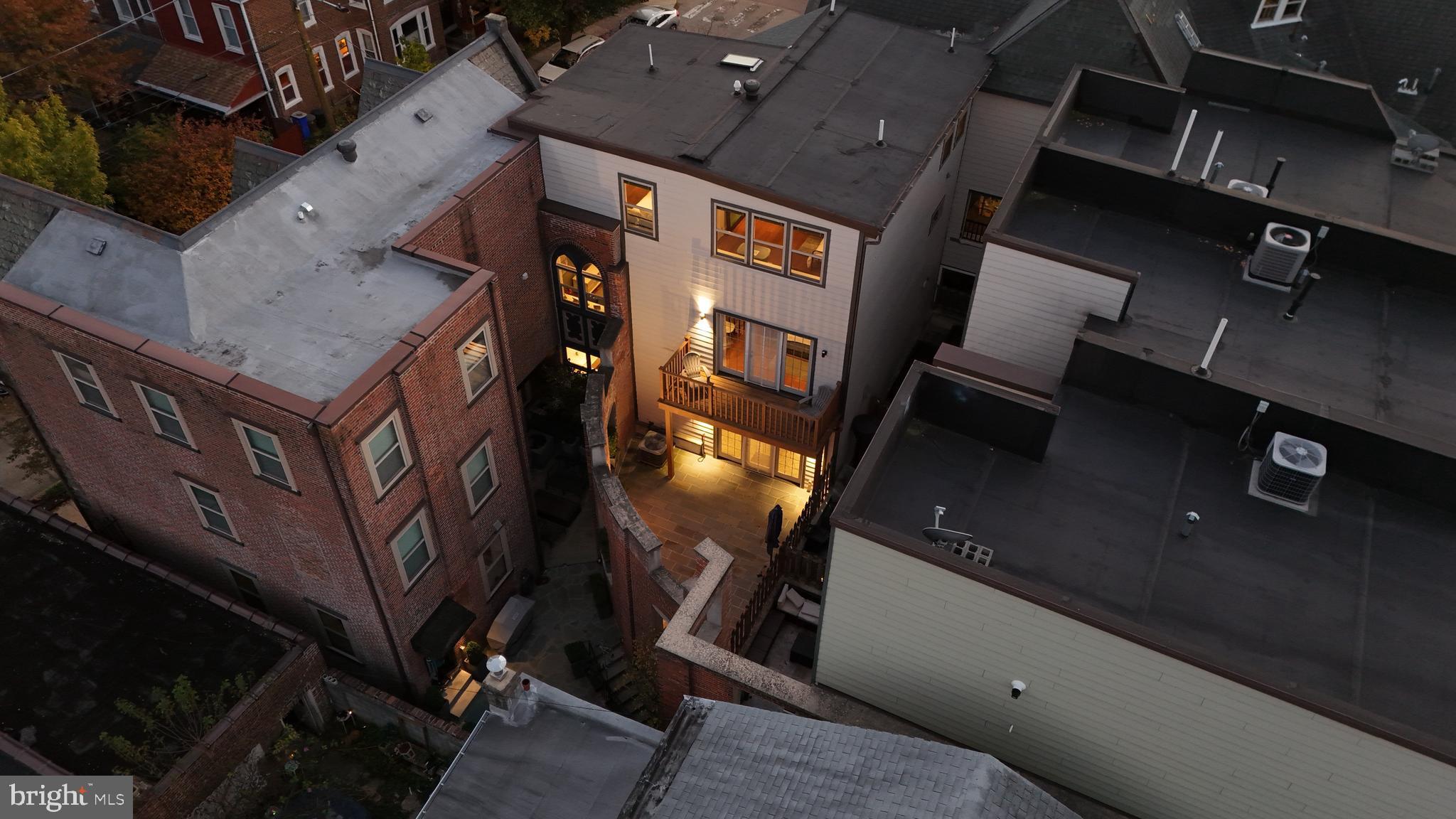 308 Monastery Avenue Philadelphia, PA 19128 - Photo 67 of 70 an aerial view of a residential apartment building with a yard
