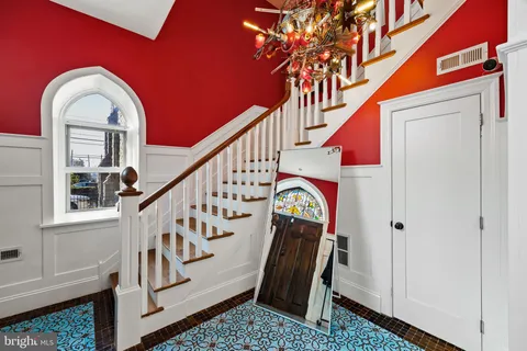 a living room with furniture fireplace and dining table