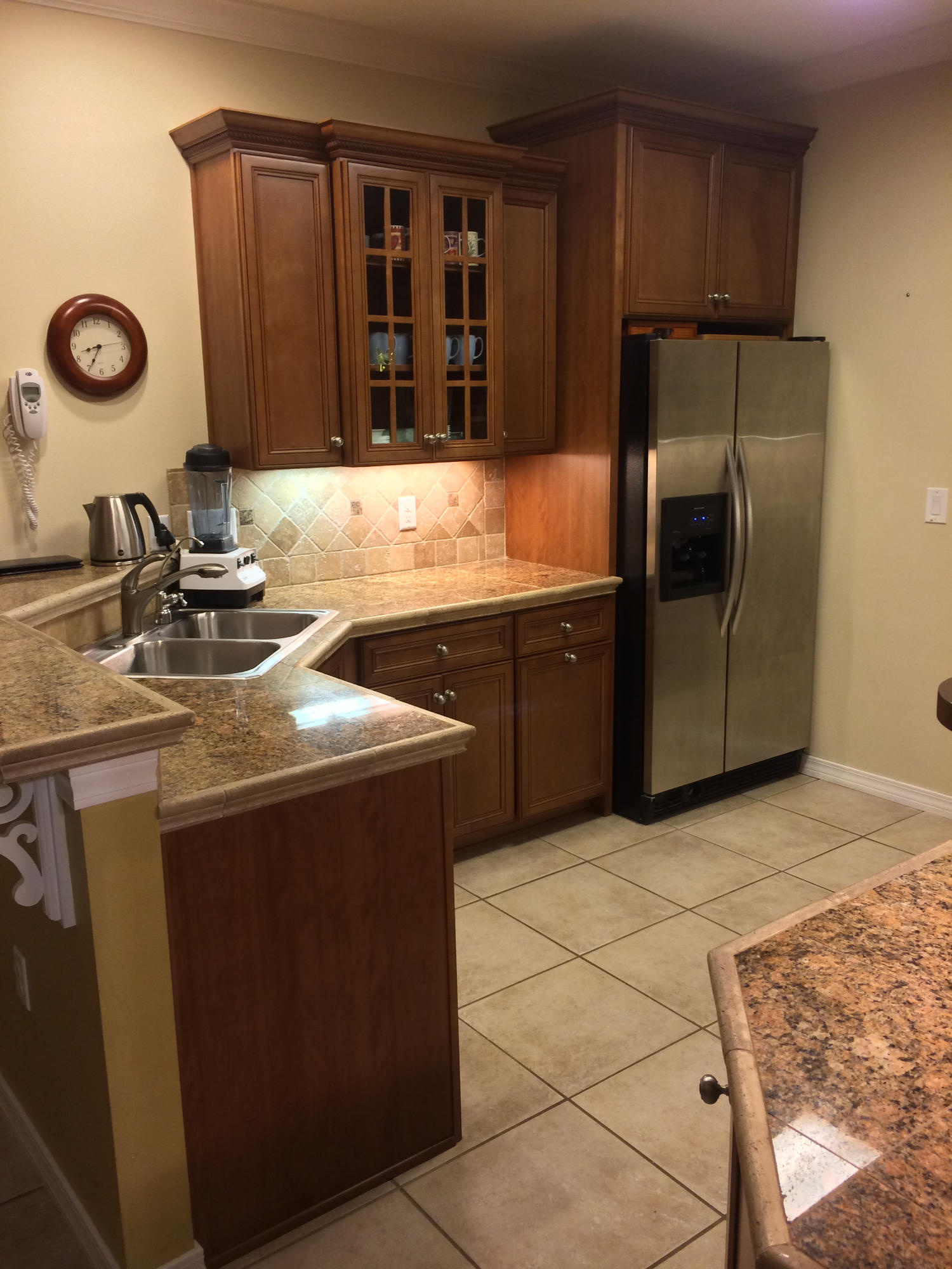 4461 Kingslynn Road Niceville, FL 32578 - Photo 12 of 38 a kitchen with stainless steel appliances granite countertop a sink stove and refrigerator