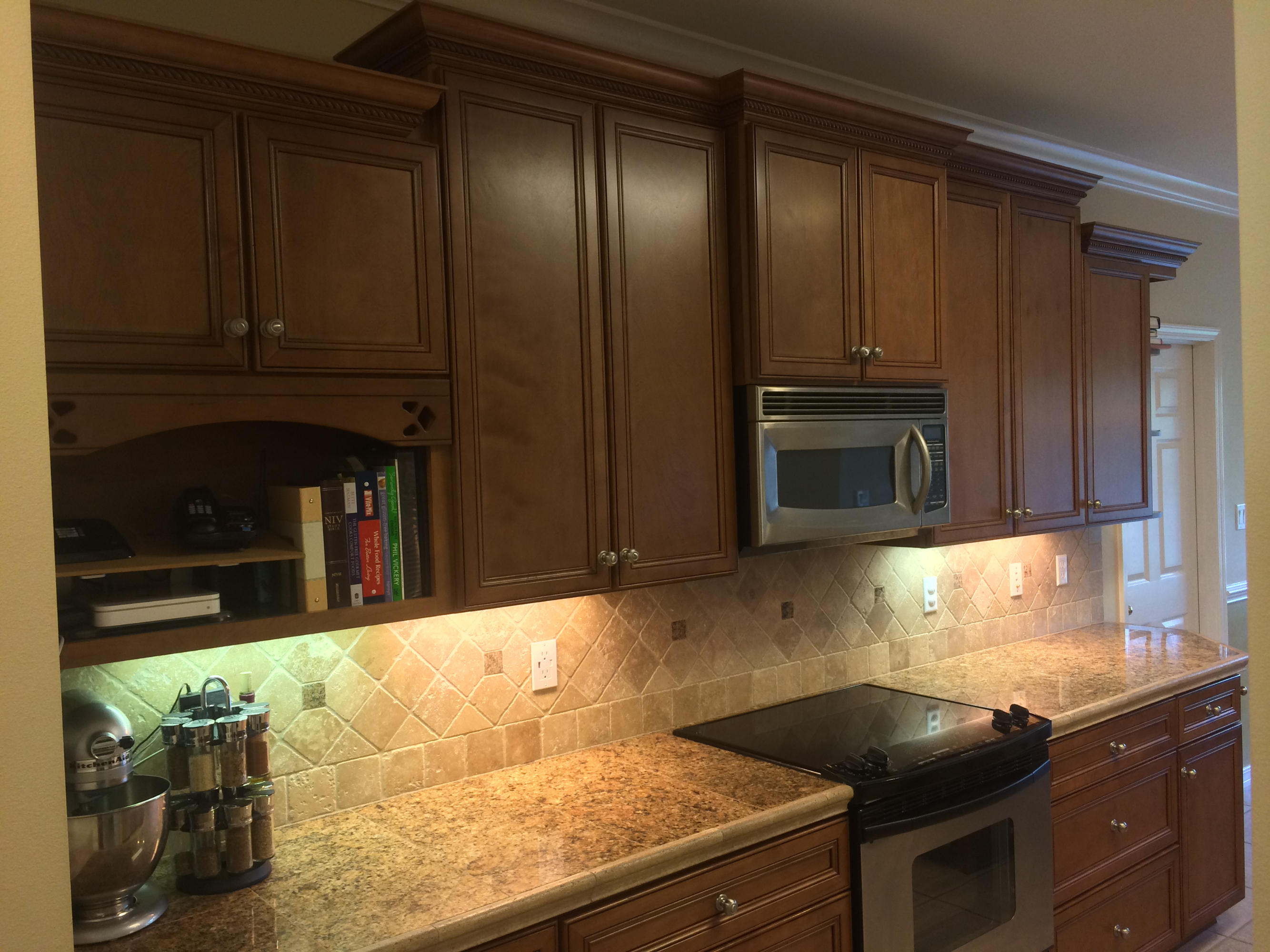 4461 Kingslynn Road Niceville, FL 32578 - Photo 14 of 38 a kitchen with granite countertop a stove and cabinets