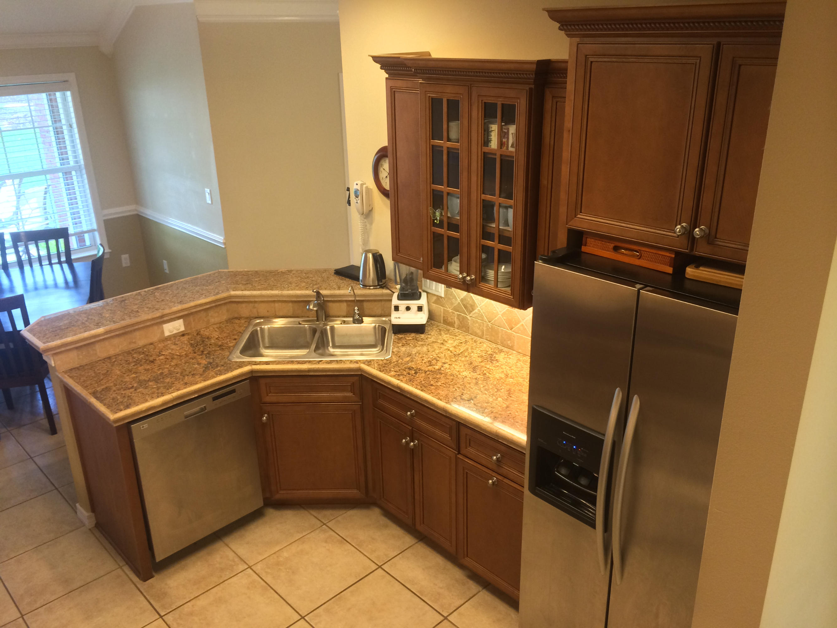 4461 Kingslynn Road Niceville, FL 32578 - Photo 15 of 38 a kitchen with a stove sink and cabinets