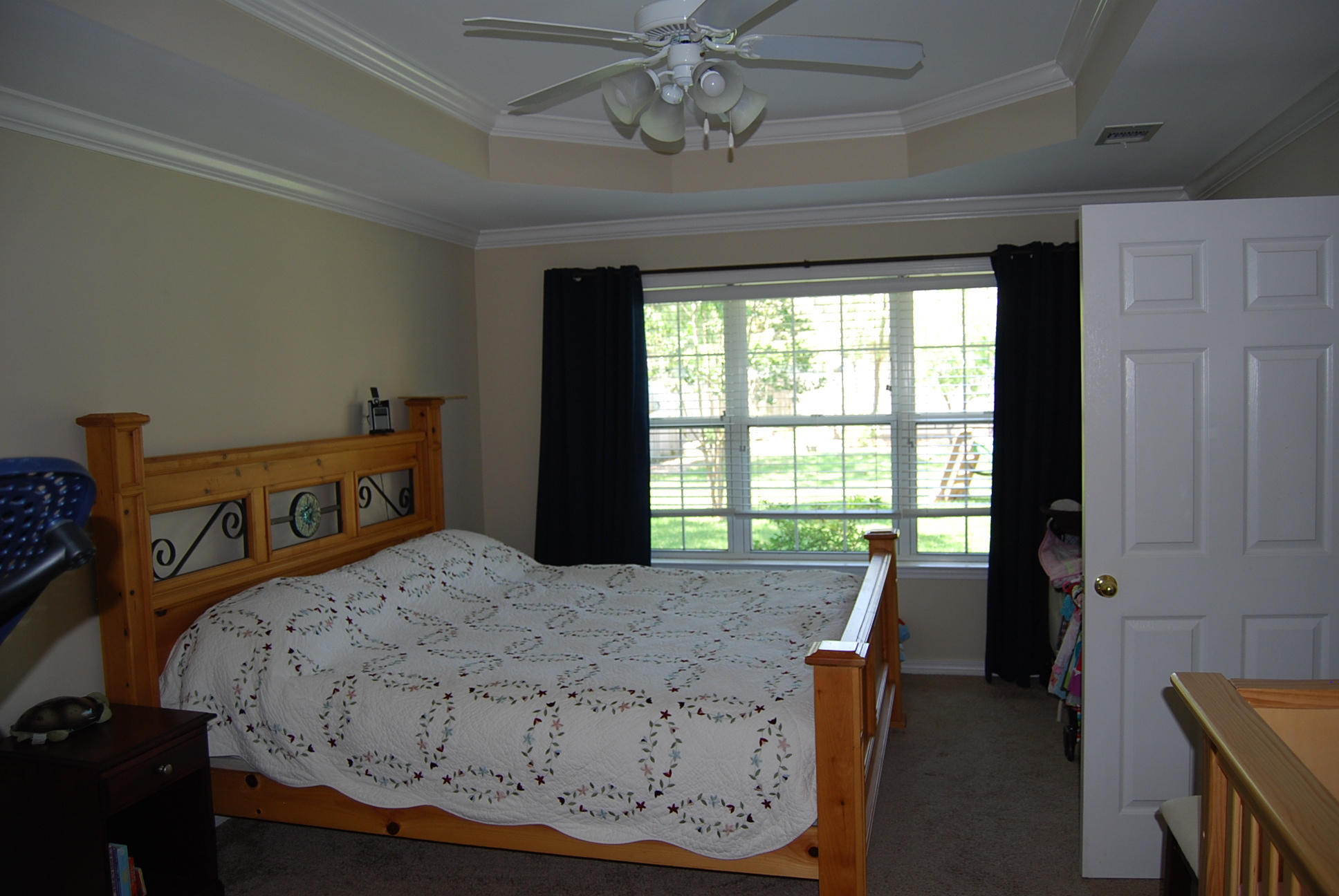 4461 Kingslynn Road Niceville, FL 32578 - Photo 17 of 38 a bedroom with a bed and a window