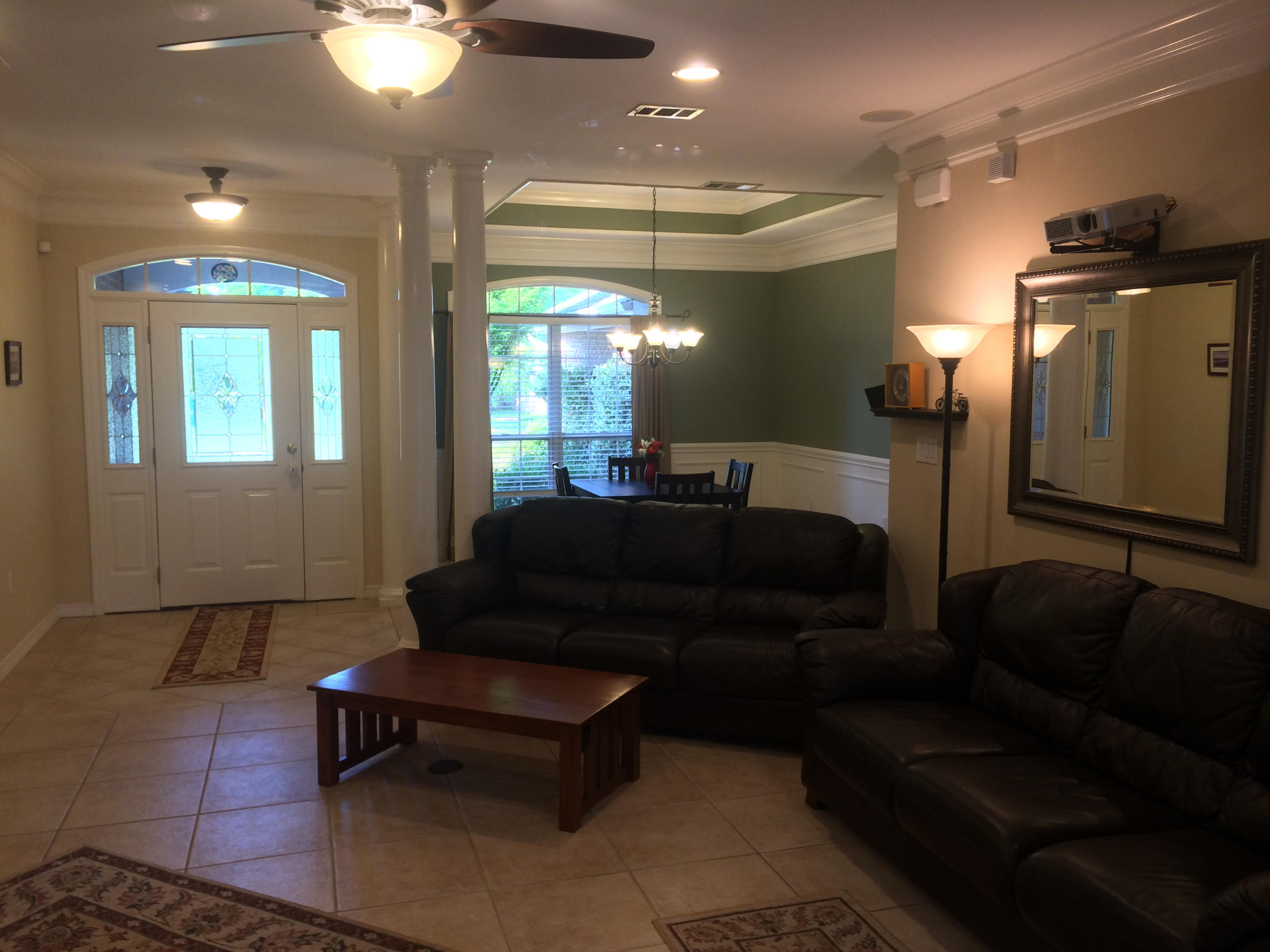 4461 Kingslynn Road Niceville, FL 32578 - Photo 6 of 38 a living room with furniture and a lamp