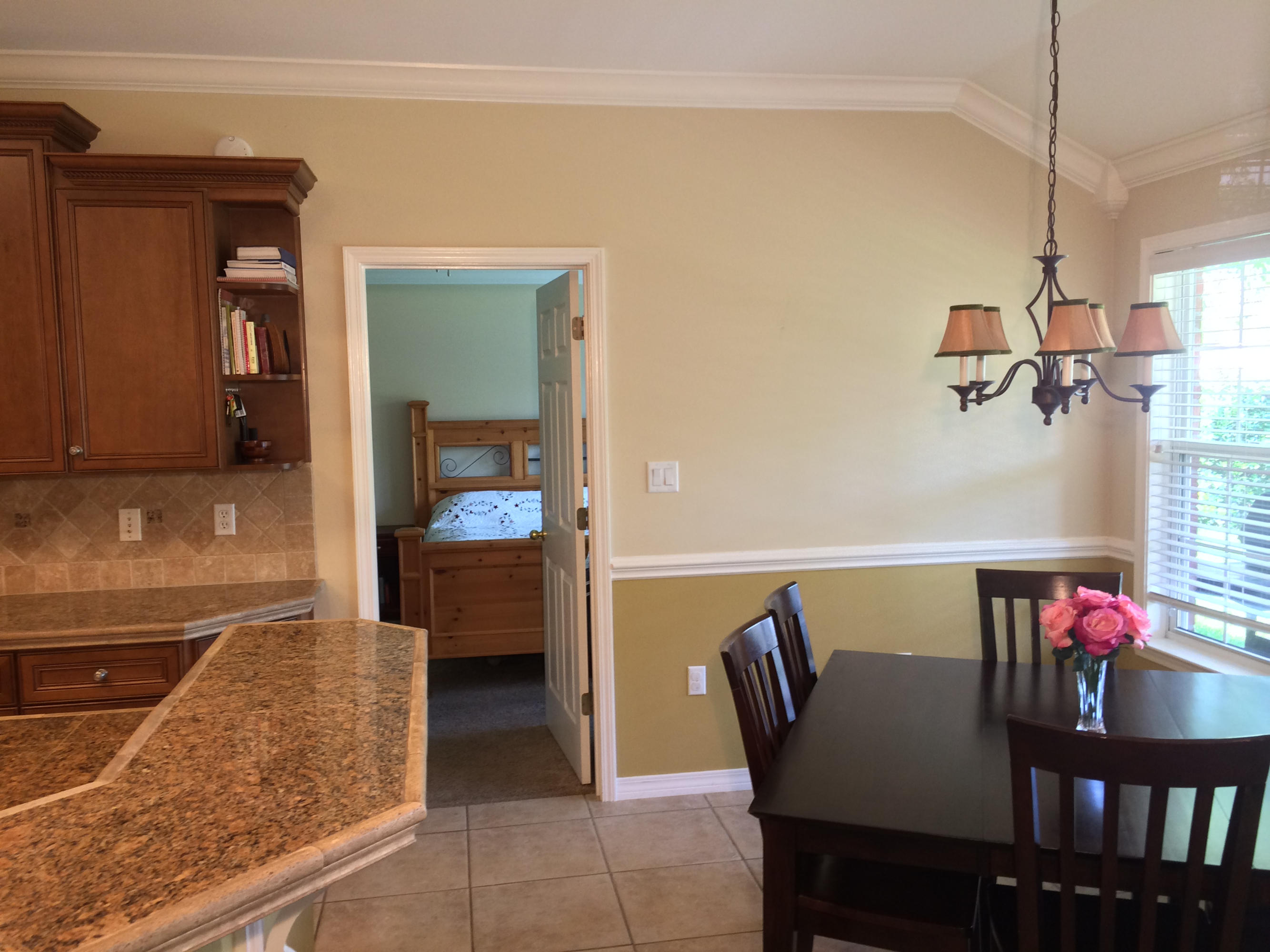 4461 Kingslynn Road Niceville, FL 32578 - Photo 8 of 38 a dining room with furniture and a chandelier