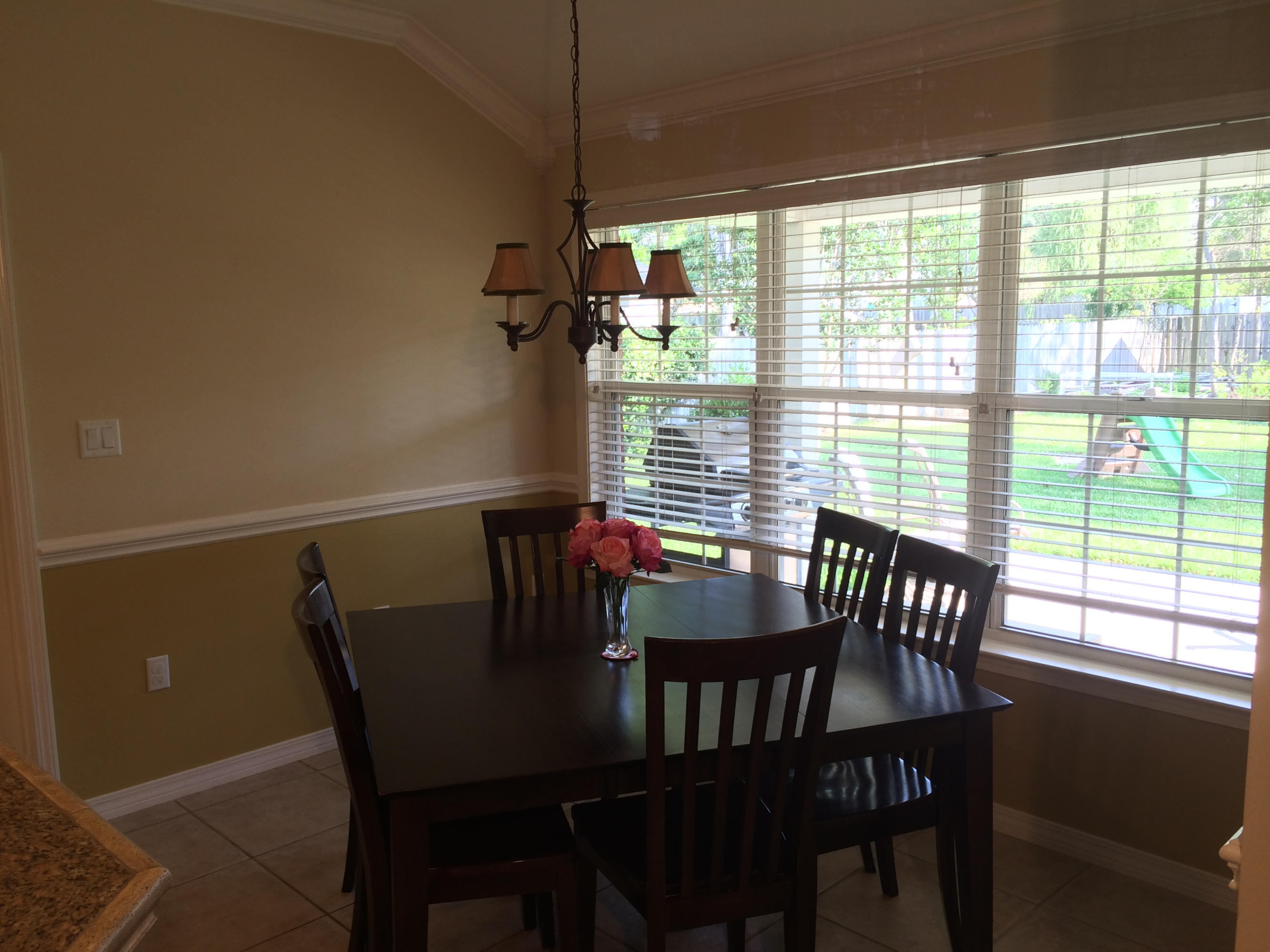 4461 Kingslynn Road Niceville, FL 32578 - Photo 9 of 38 a view of a dining room with furniture window and outside view