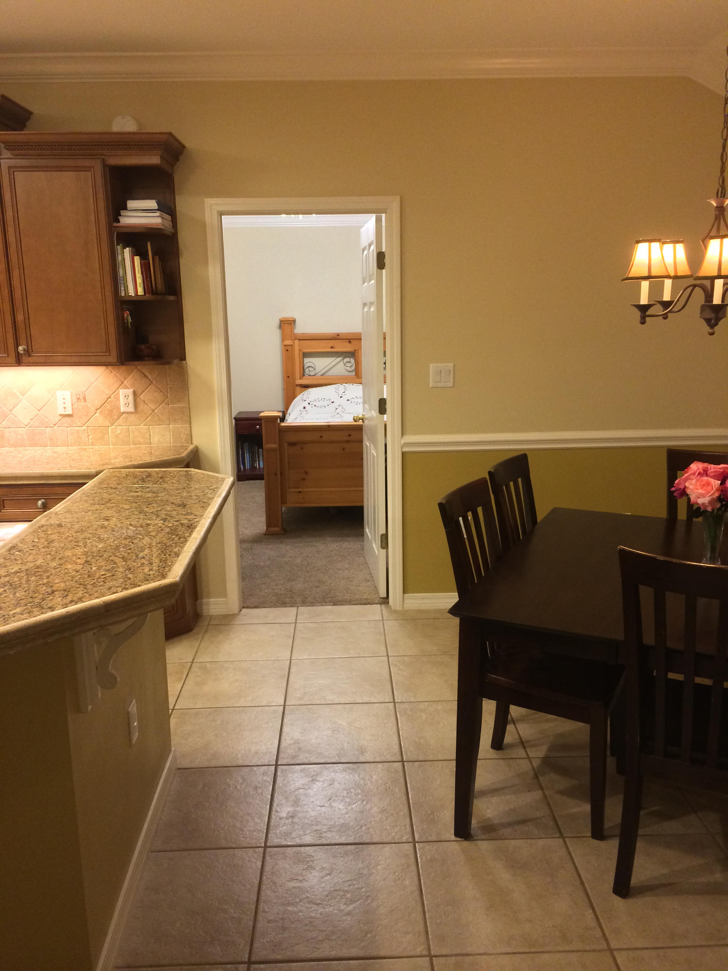 4461 Kingslynn Road Niceville, FL 32578 - Photo 10 of 38 a living room with a couch and a dining table with wooden floor