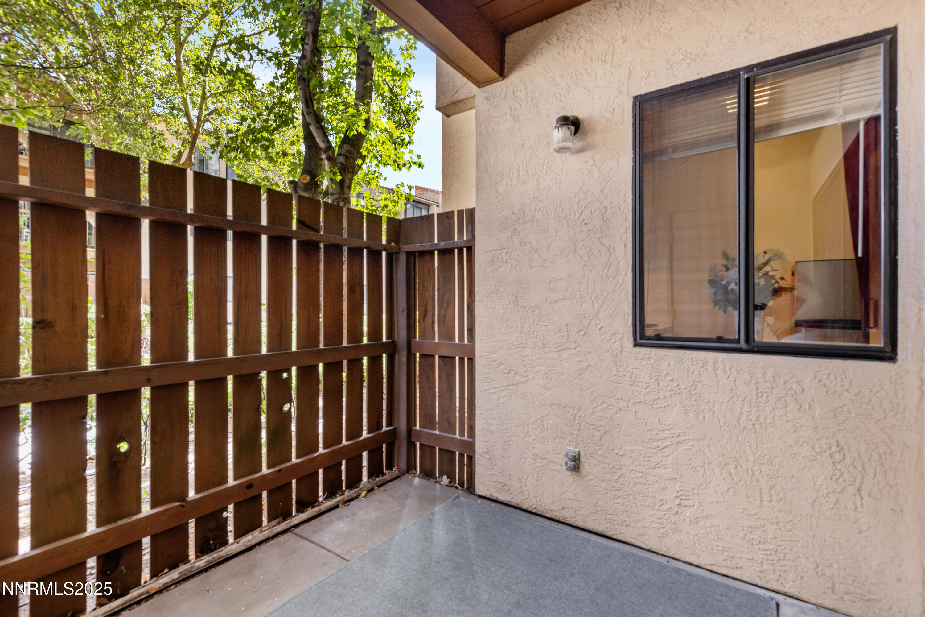 2750 Plumas Street, Unit 109 Reno, NV 89509 - Photo 14 of 19 a view of a door with wooden fence