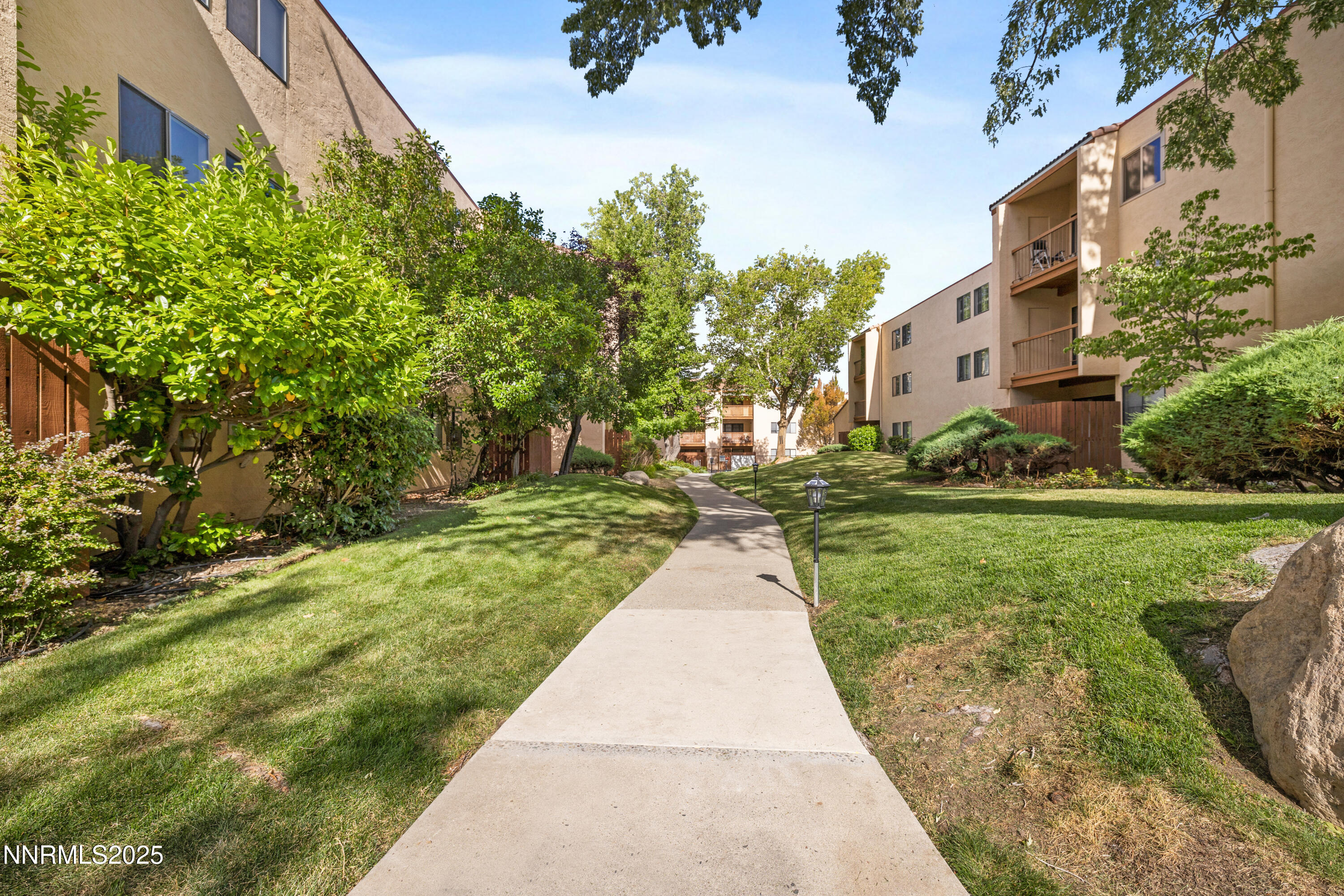 2750 Plumas Street, Unit 109 Reno, NV 89509 - Photo 19 of 19 a pathway of a house with a yard