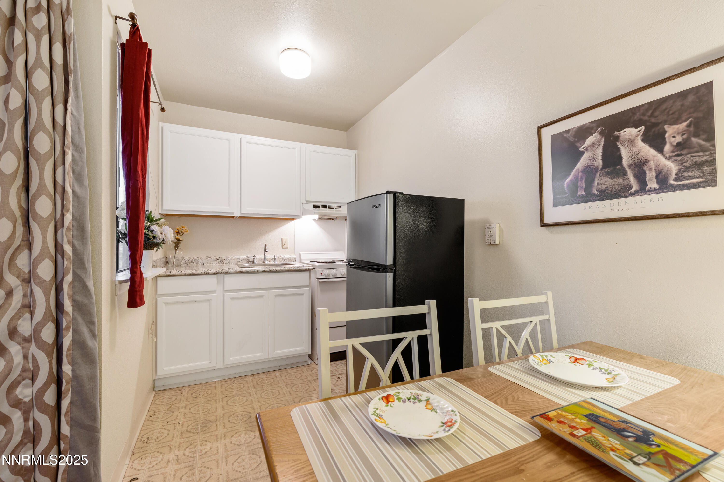 2750 Plumas Street, Unit 109 Reno, NV 89509 - Photo 2 of 19 a kitchen with a appliances cabinets and furniture