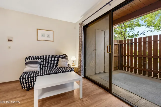 a view of a balcony with wooden floor