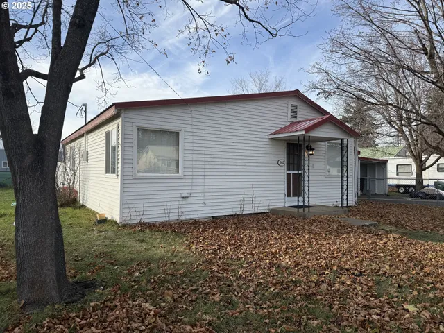 a house with trees in the background
