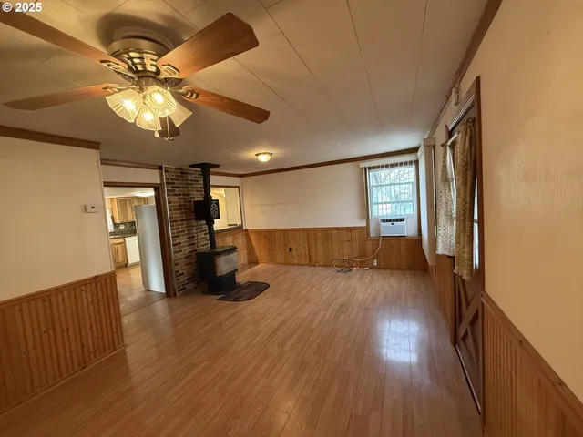 a view of a livingroom with wooden floor