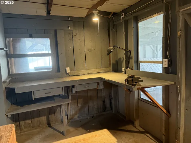 a bed sitting in a bedroom and chandelier