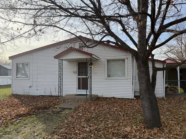 a small white house with a outdoor space