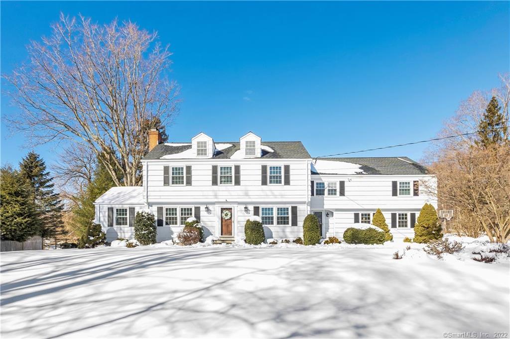 208 North Cedar Road Fairfield, CT 06824 - Photo 1 of 1 a front view of a building with a garden and pathway