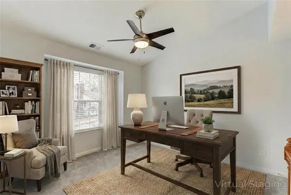 a work room with furniture and a window