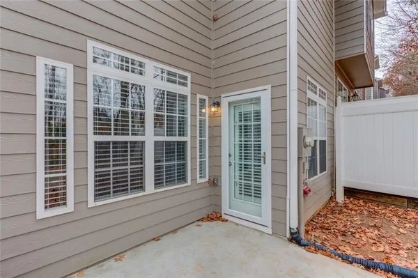 a view of a patio with couches chairs and potted plants
