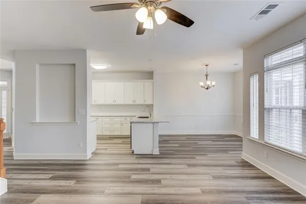 a view of a kitchen with a sink and dishwasher kitchen view with wooden floor