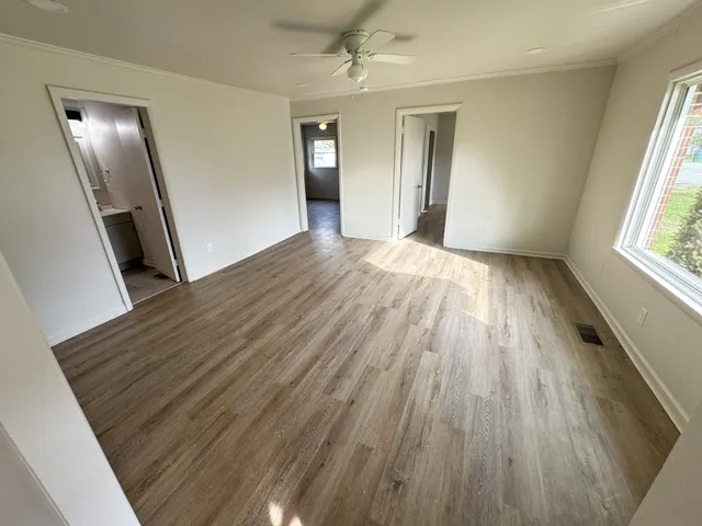 a bedroom with bed and a window