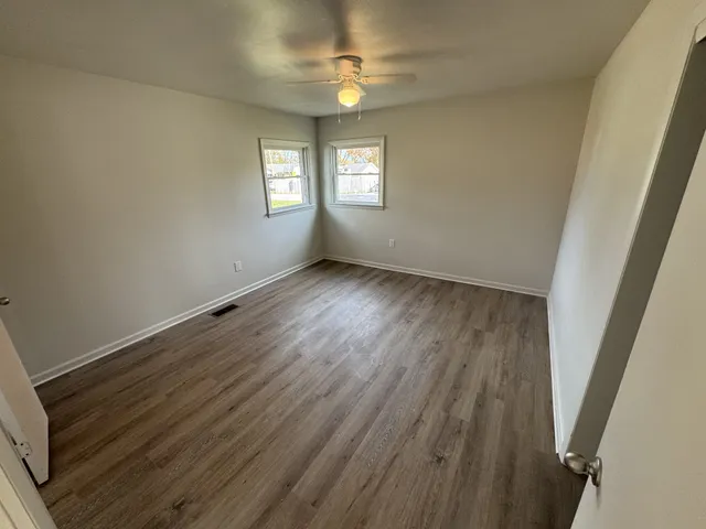 a bathroom with a bathtub a sink a toilet and a mirror