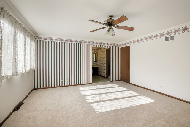 3915 Rugen Road Glenview, IL 60025 - Photo 6 of 11 a view of a livingroom with a hardwood floor and staircase