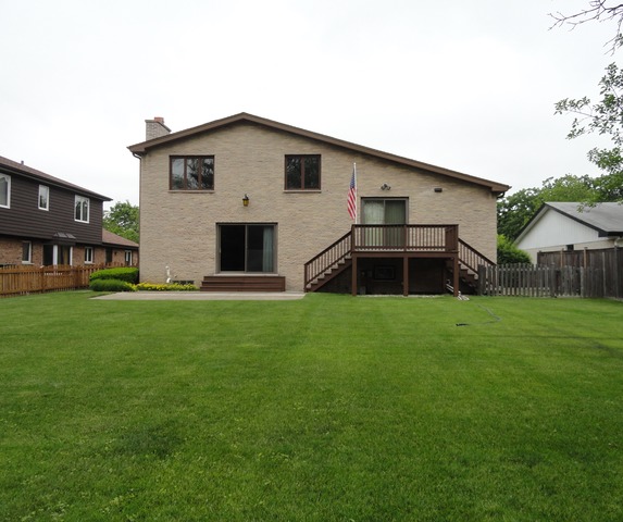 3915 Rugen Road Glenview, IL 60025 - Photo 10 of 11 a front view of house with a garden
