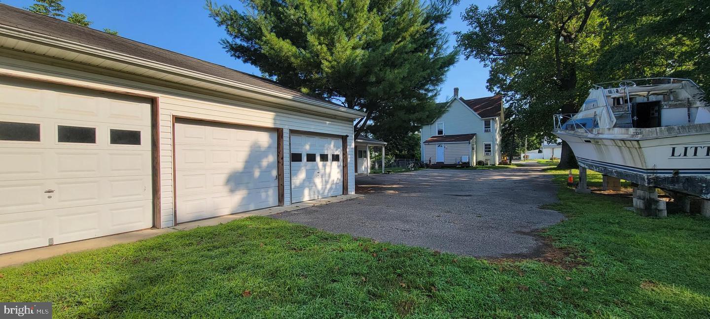 348 White Horse Pike Clementon, NJ 08021 - Photo 8 of 8 a view of backyard with barbeque grill and a large tree