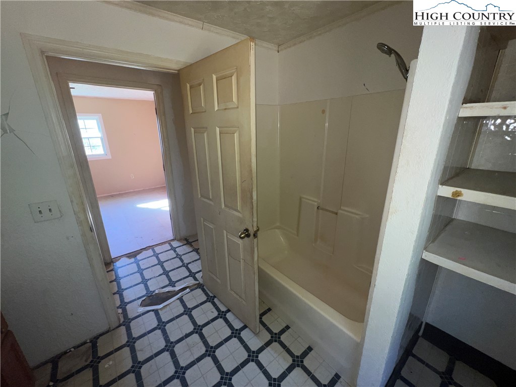 355 Round Knob Church Road West Jefferson, NC 28694 - Photo 14 of 23 a bathroom with a glass door shower
