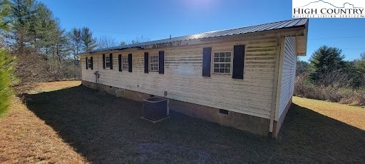 355 Round Knob Church Road West Jefferson, NC 28694 - Photo 18 of 23 a view of a house with backyard