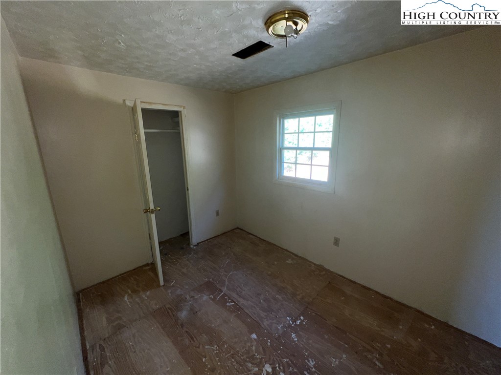 355 Round Knob Church Road West Jefferson, NC 28694 - Photo 9 of 23 an empty room with a window