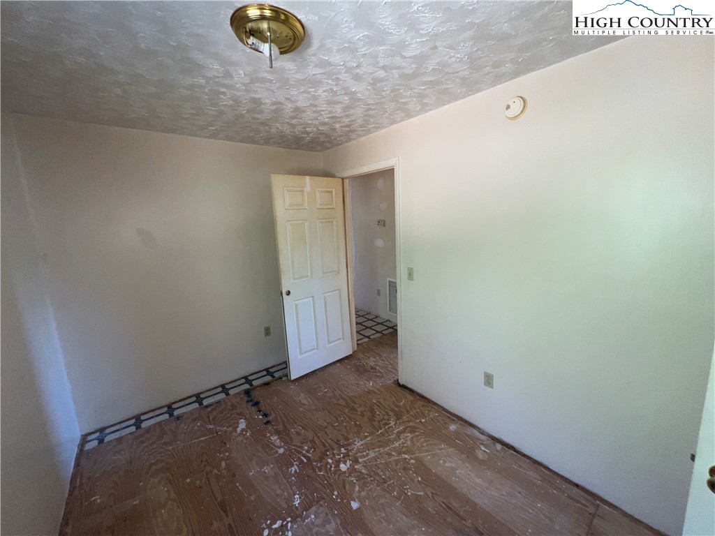 355 Round Knob Church Road West Jefferson, NC 28694 - Photo 10 of 23 a view of an empty room