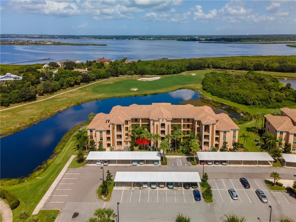 Front View of Building Showing Location of Condo as well as lake view, the 5th hole on the Sanctuary and the Manatee River in the distance.