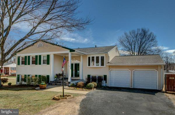 a front view of a house with garage