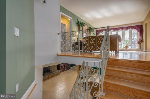 8011 Langbrook Road Springfield, VA 22152 - Photo 2 of 30 a view of a living room and a wooden floor