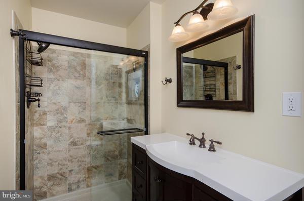 8011 Langbrook Road Springfield, VA 22152 - Photo 15 of 30 a bathroom with a sink and a mirror