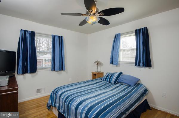 8011 Langbrook Road Springfield, VA 22152 - Photo 17 of 30 a bedroom with bed tv and window