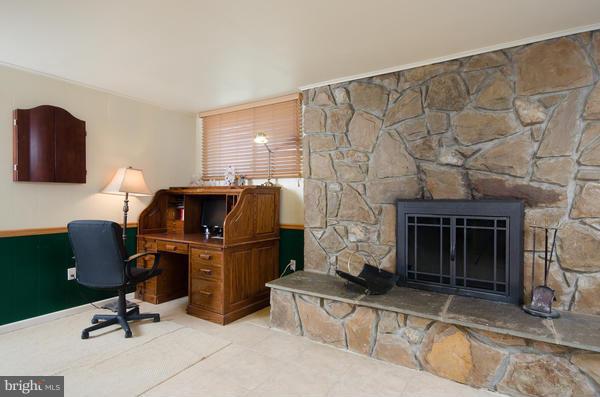 8011 Langbrook Road Springfield, VA 22152 - Photo 21 of 30 a living room with furniture and a fireplace