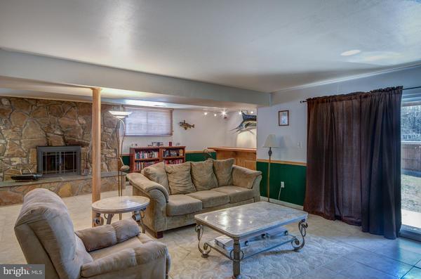 8011 Langbrook Road Springfield, VA 22152 - Photo 24 of 30 a living room with furniture and a fireplace