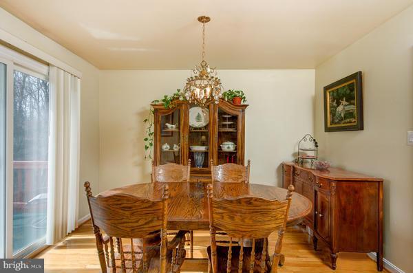 8011 Langbrook Road Springfield, VA 22152 - Photo 10 of 30 a view of a dining room with furniture and chandelier