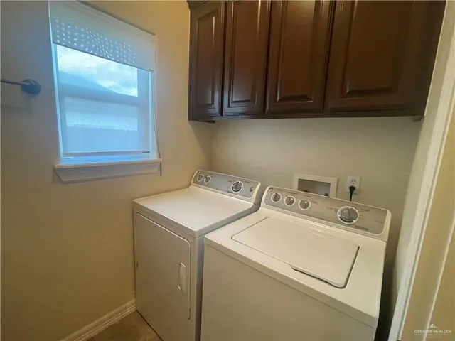 a white toilet sitting next to a bath tub