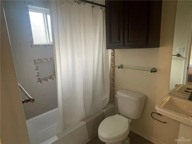 a kitchen with stainless steel appliances kitchen island granite countertop a stove and a refrigerator