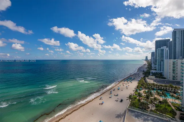 a view of a lake with a yard