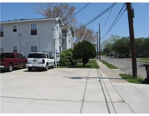 a view of a car parked in front of a house
