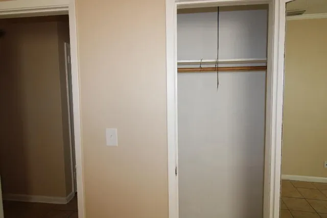 a bathroom with a sink and mirror with window