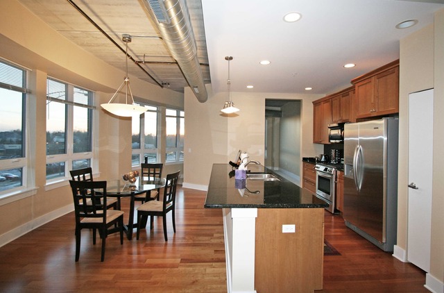 450 Village Center Drive, Unit 305 Burr Ridge, IL 60527 - Photo 4 of 10 a view of a dining room with furniture window and wooden floor